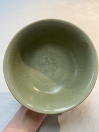 A Chinese Longquan celadon bowl with floral anhua design, Ming