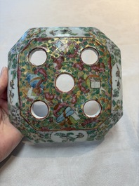 A pair of Chinese Canton famille rose flower holders and covers with figural design, 19th C.