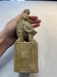 A Chinese soapstone carving of a boy riding an elephant, 20th C.