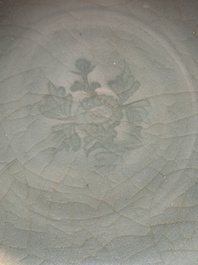 A Chinese Longquan celadon bowl with floral anhua design, Ming