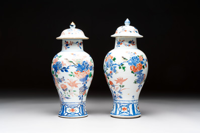A pair of Chinese verte-Imari 'birds among flowering branches' vases and covers, Kangxi