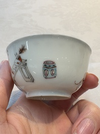 A Chinese iron-red-decorated 'boy and buffalo' cup and saucer and a famille rose 'Xi Xiang Ji' cup and saucer, Qianlong
