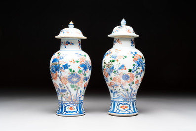 A pair of Chinese verte-Imari 'birds among flowering branches' vases and covers, Kangxi