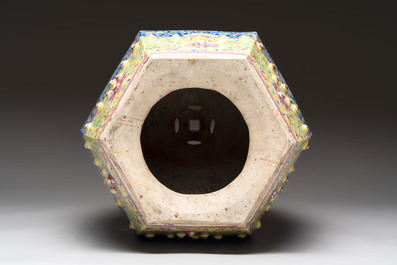 A Chinese famille rose blue and yellow-ground hexagonal garden seat, 19th C.