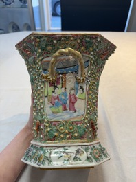 A pair of Chinese Canton famille rose flower holders and covers with figural design, 19th C.