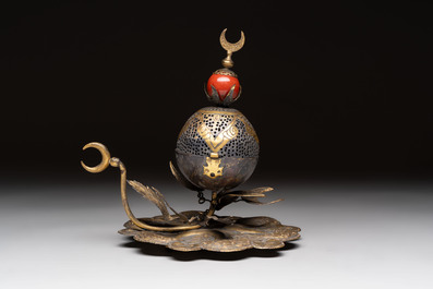 An Ottoman gilt-bronze inscribed incense burner with a red stone, 19th C.