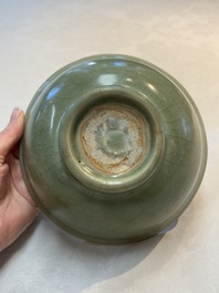 A Chinese Longquan celadon bowl with floral anhua design, Ming