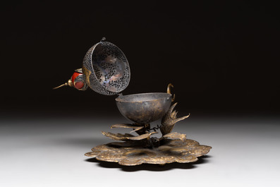 An Ottoman gilt-bronze inscribed incense burner with a red stone, 19th C.