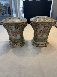 A pair of Chinese Canton famille rose flower holders and covers with figural design, 19th C.
