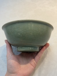 A Chinese Longquan celadon bowl with floral anhua design, Ming