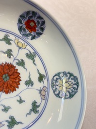 A Chinese doucai plate with stylised floral design, Chenghua mark, Kangxi/Yongzheng