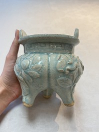 A Chinese qingbai tripod censer with floral relief design, Song/Yuan