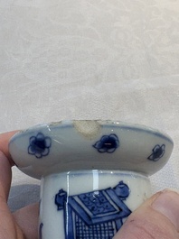 A pair of rare Chinese blue and white sanders with antiquities and floral design, Kangxi
