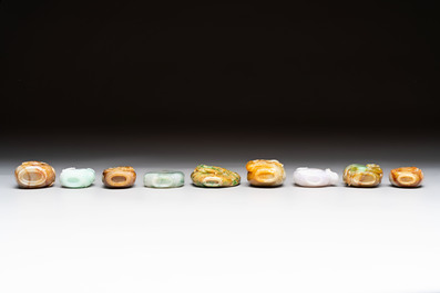 A group of nine Chinese jadeite snuff bottles, 20th C.