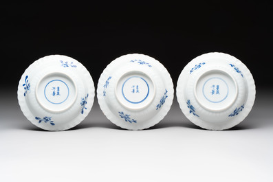 A set of six Chinese blue and white cups and saucers with floral design, Kangxi mark, 19th C.