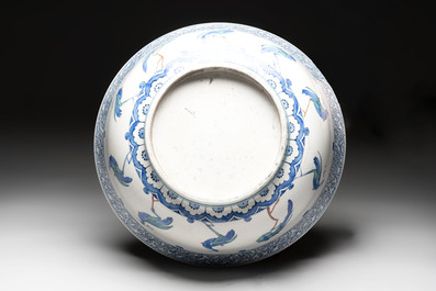 A large polychrome Iznik-style 'peacocks' bowl on a wooden stand, Samson, Paris, 19th C.