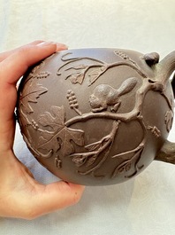 A Chinese Yixing stoneware 'squirrels among grape vines' teapot and cover, Kangxi