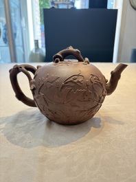 A Chinese Yixing stoneware 'squirrels among grape vines' teapot and cover, Kangxi