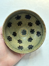 A Chinese Jizhou papercut resist-decorated 'plum blossom' bowl and a white-glazed bowl, Southern Song/Ming