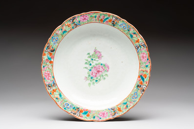 Four Chinese Canton famille rose plates and a covered double-teapot, 19th C.