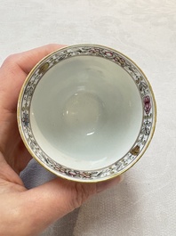 A Chinese famille rose 'erotic subject' cup and saucer, Yongzheng/Qianlong