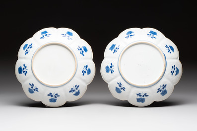 A pair of Chinese blue and white lotus-form 'Grasshopper' plates, Kangxi