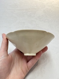 A Chinese Jizhou papercut resist-decorated 'plum blossom' bowl and a white-glazed bowl, Southern Song/Ming