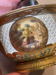 A Chinese European-decorated gilt bronze-mounted blue and white reticulated bowl, Transitional period