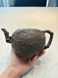 A Chinese Yixing stoneware 'squirrels among grape vines' teapot and cover, Kangxi