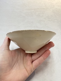 A Chinese Jizhou papercut resist-decorated 'plum blossom' bowl and a white-glazed bowl, Southern Song/Ming