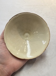 A Chinese Jizhou papercut resist-decorated 'plum blossom' bowl and a white-glazed bowl, Southern Song/Ming