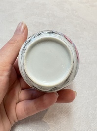 A Chinese famille rose 'erotic subject' cup and saucer, Yongzheng/Qianlong