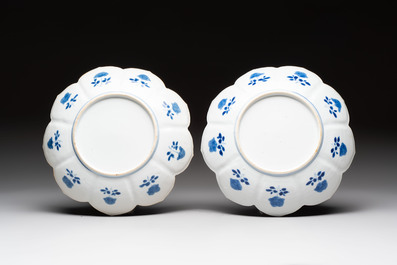 A pair of Chinese blue and white lotus-form 'grasshopper' plates, Kangxi