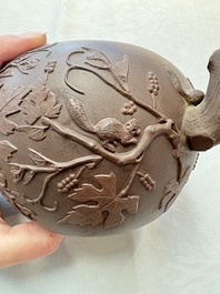 A Chinese Yixing stoneware 'squirrels among grape vines' teapot and cover, Kangxi