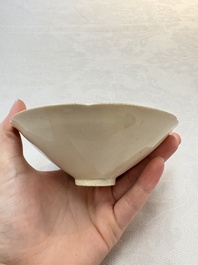 A Chinese Jizhou papercut resist-decorated 'plum blossom' bowl and a white-glazed bowl, Southern Song/Ming