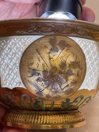 A Chinese European-decorated gilt bronze-mounted blue and white reticulated bowl, Transitional period