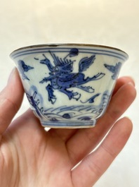A pair of Chinese blue and white 'flying horses' cups, Jiajing mark, Kangxi