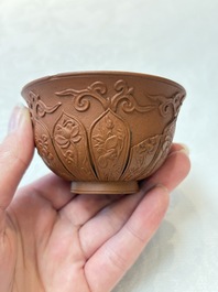 A set of five Chinese Yixing stoneware cups with floral design, Kangxi