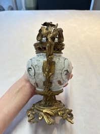A Chinese famille verte covered bowl, a Dutch-decorated bowl, a gilt-bronze mounted pot-pourri vase and an Imari-style covered jug, Kangxi/Qianlong