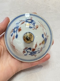 A pair of Chinese verte-Imari 'birds among flowering branches' vases and covers, Kangxi