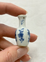 Ten Chinese blue and white miniature vases with figural and floral design, Kangxi