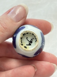 Ten Chinese blue and white miniature vases with figural and floral design, Kangxi