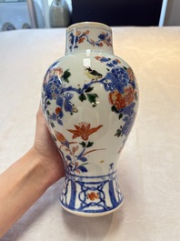 A pair of Chinese verte-Imari 'birds among flowering branches' vases and covers, Kangxi