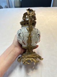 A Chinese famille verte covered bowl, a Dutch-decorated bowl, a gilt-bronze mounted pot-pourri vase and an Imari-style covered jug, Kangxi/Qianlong