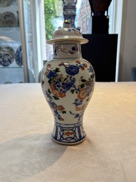 A pair of Chinese verte-Imari 'birds among flowering branches' vases and covers, Kangxi