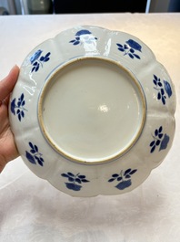 A pair of Chinese blue and white lotus-form 'Grasshopper' plates, Kangxi