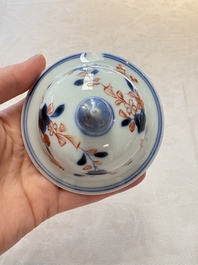 A pair of Chinese verte-Imari 'birds among flowering branches' vases and covers, Kangxi