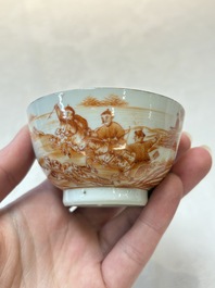 A pair of Chinese iron-red-decorated 'deer hunting' cups and saucers, Qianlong
