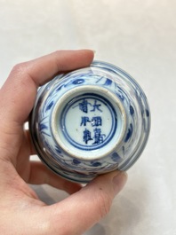 A pair of Chinese blue and white 'flying horses' cups, Jiajing mark, Kangxi