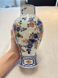 A pair of Chinese verte-Imari 'birds among flowering branches' vases and covers, Kangxi